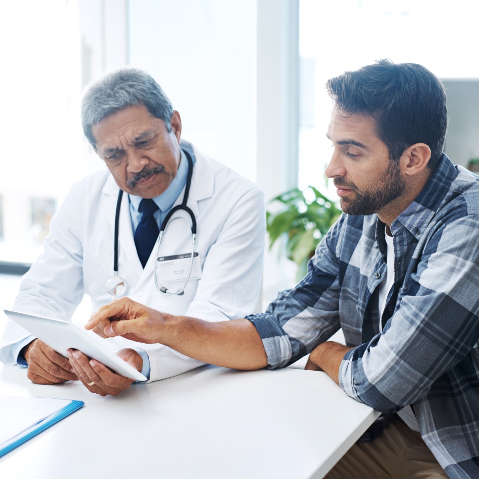 When last did you see a doctor. Shot of a mature male doctor and patient having a discussion in the doctors office before a checkup.