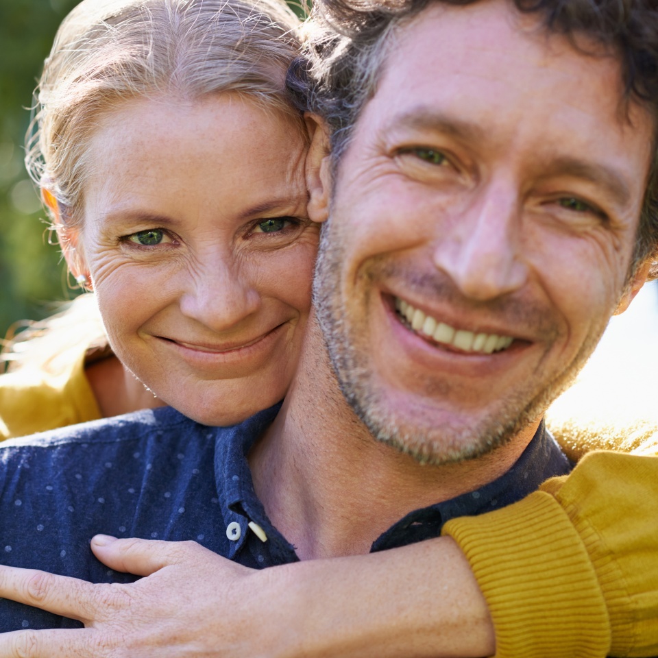 Love and dedication. Cropped shot of an affectionate husband and wife standing outdoors.